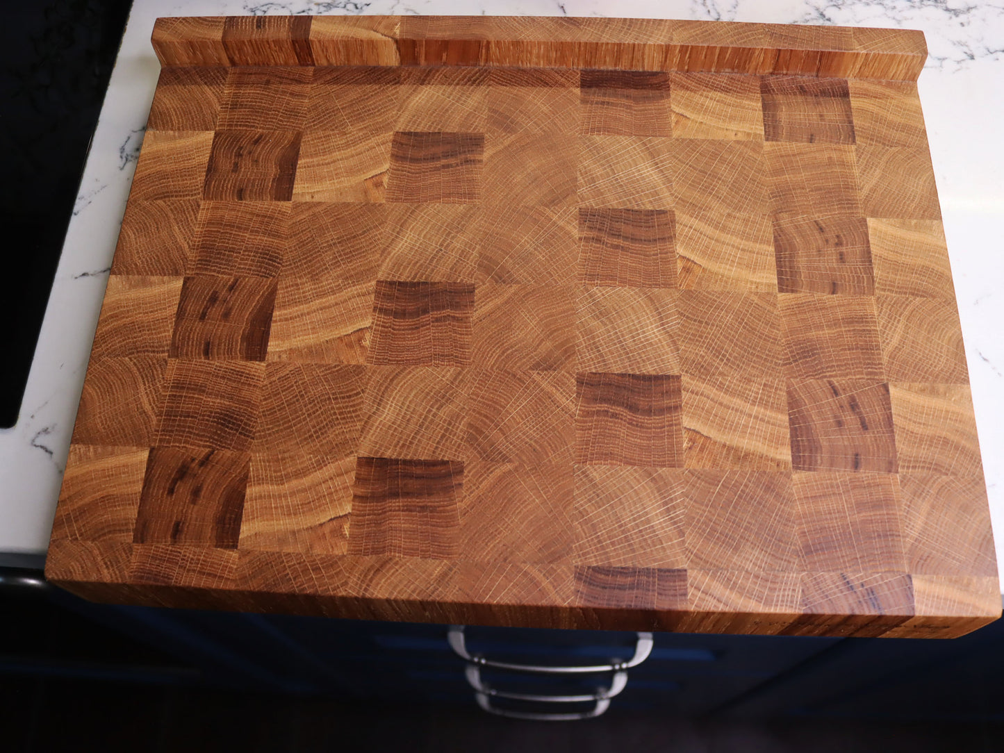 Unique end grain cutting board with double-side counter lip