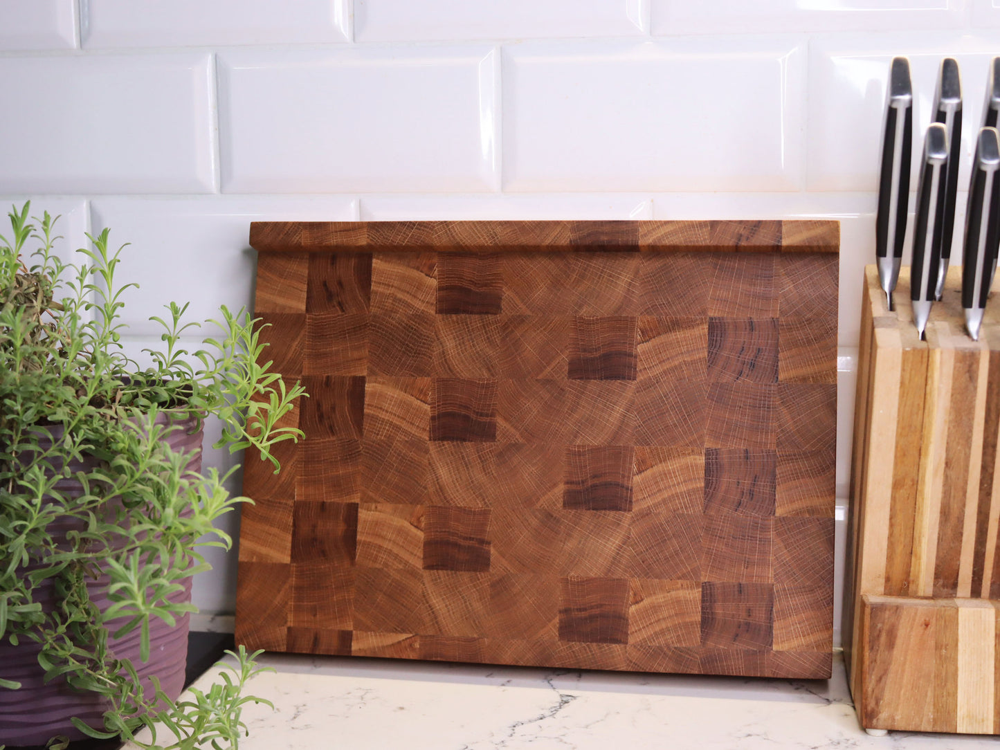 Unique end grain cutting board with double-side counter lip