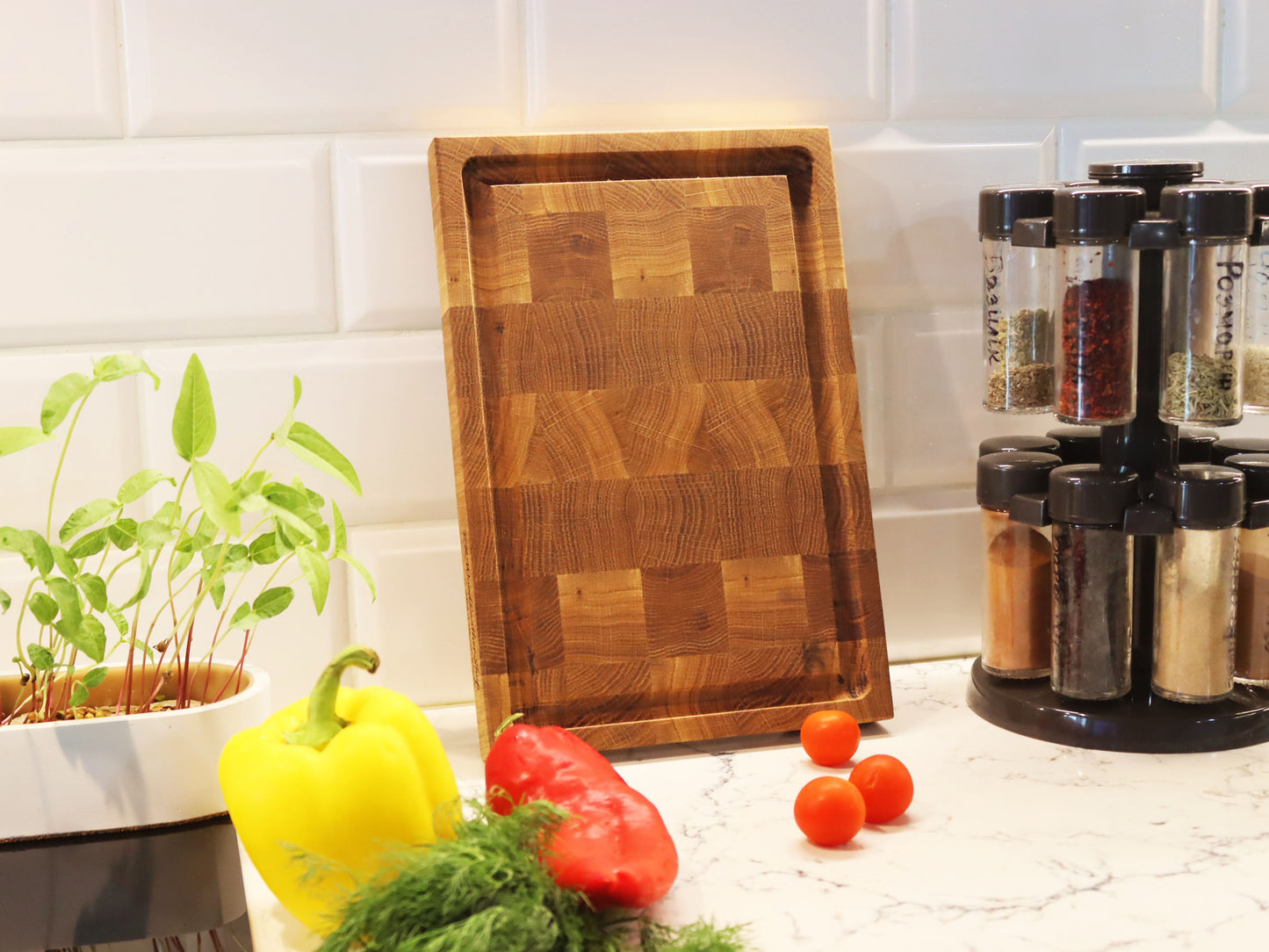 Exclusive end grain cutting board with a juice groove