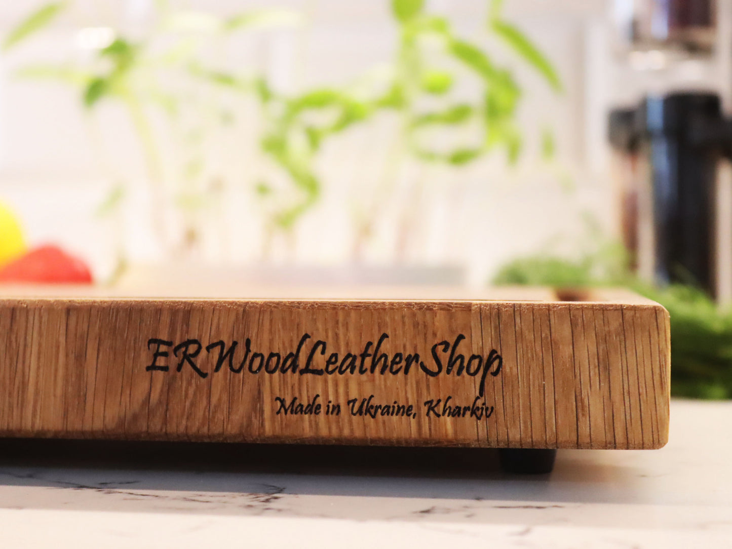 Exclusive end grain cutting board with a juice groove