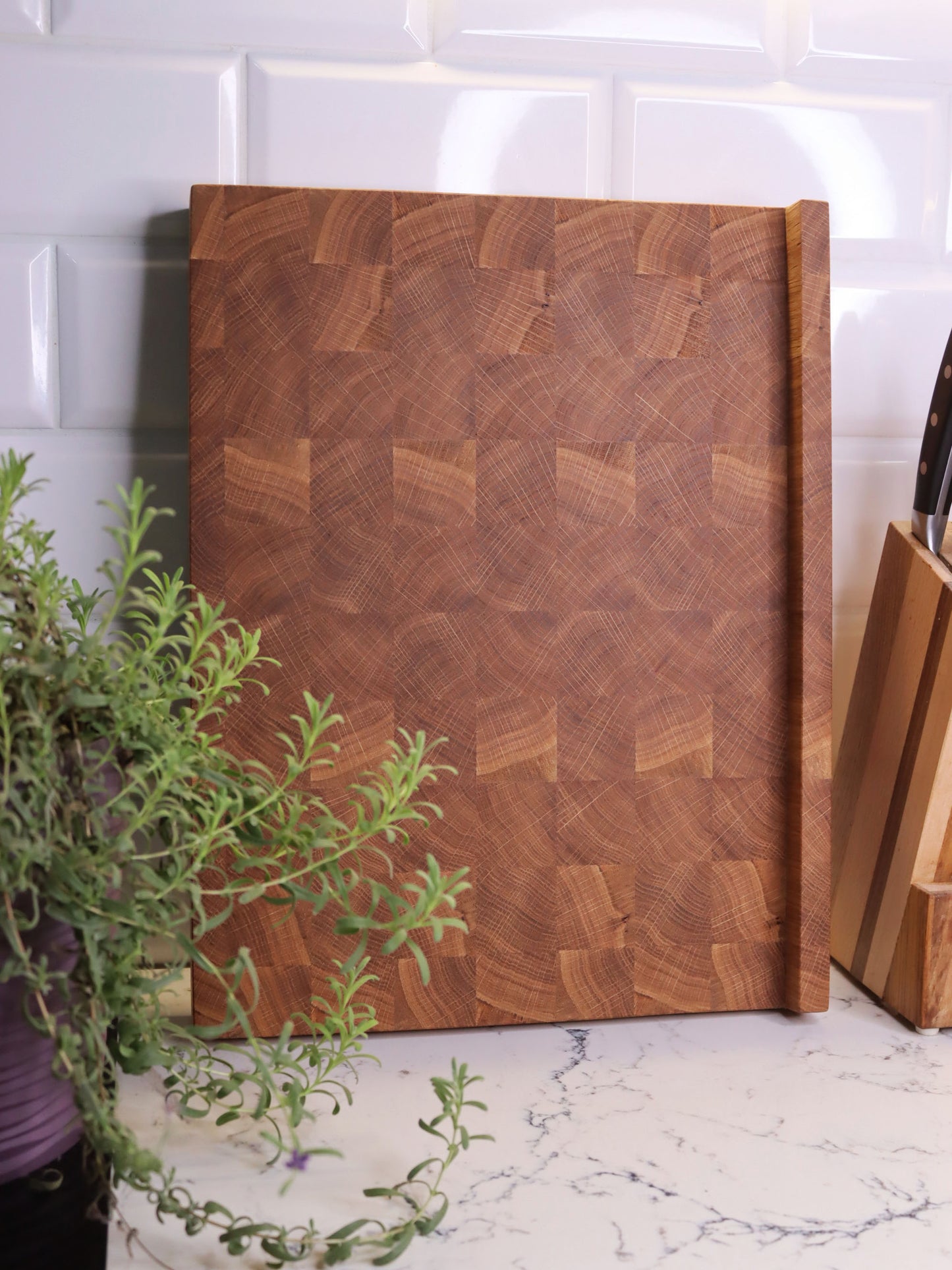 Unique end grain cutting board with double-side counter lip