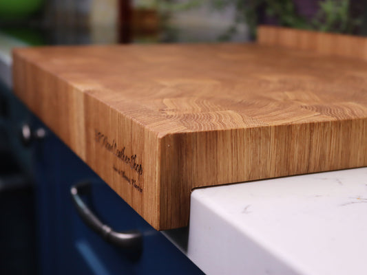 Unique end grain cutting board with double-side counter lip