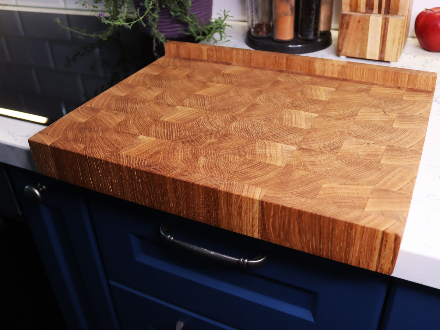 Unique end grain cutting board with double-side counter lip