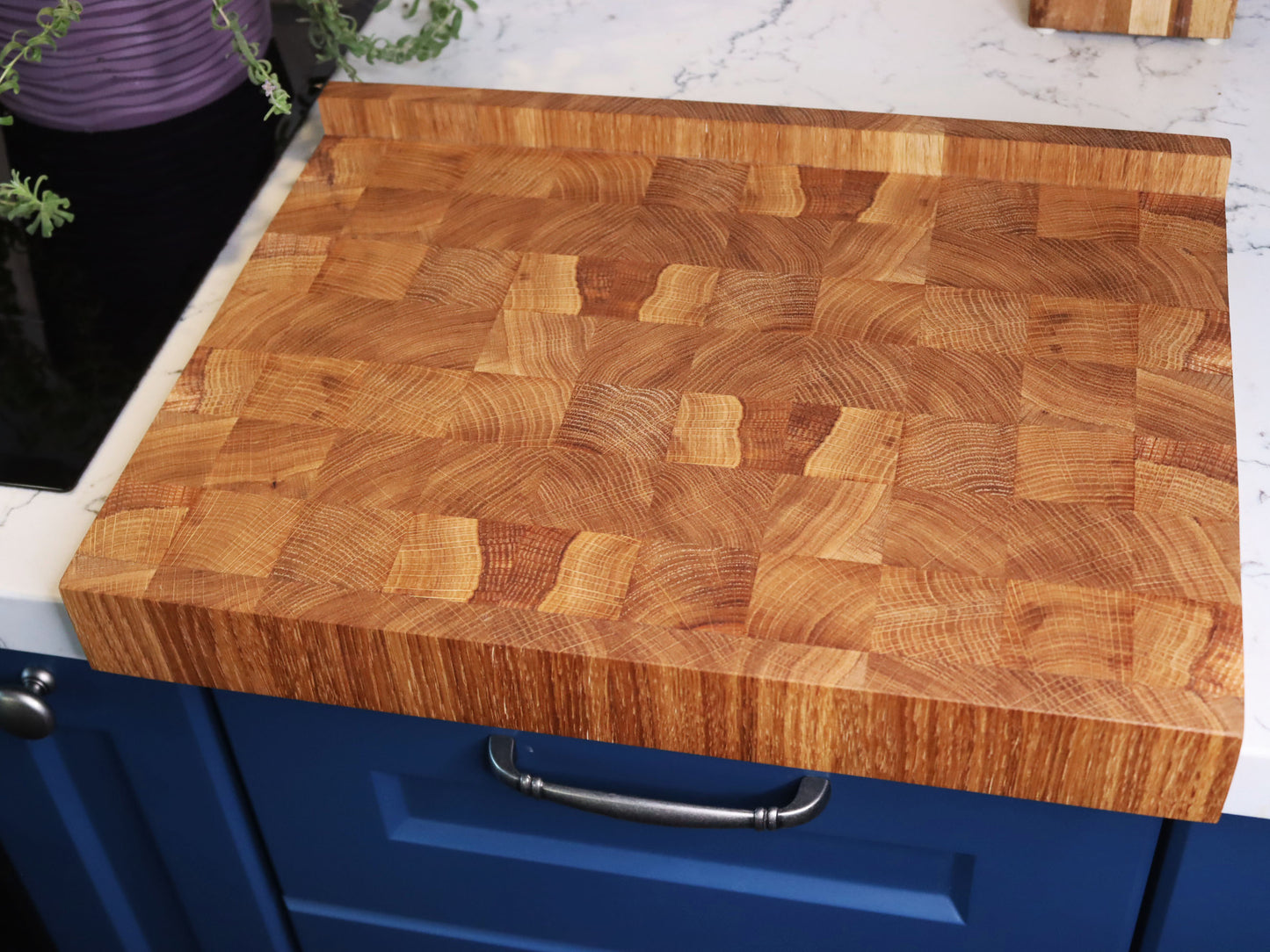 Unique end grain cutting board with double-side counter lip