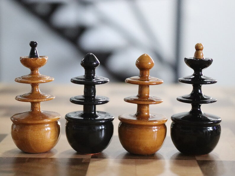 Reproduction of tsarist russia roly poly chess pieces with chessboard