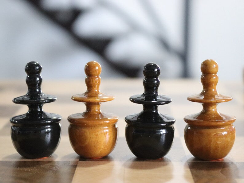 Reproduction of tsarist russia roly poly chess pieces with chessboard