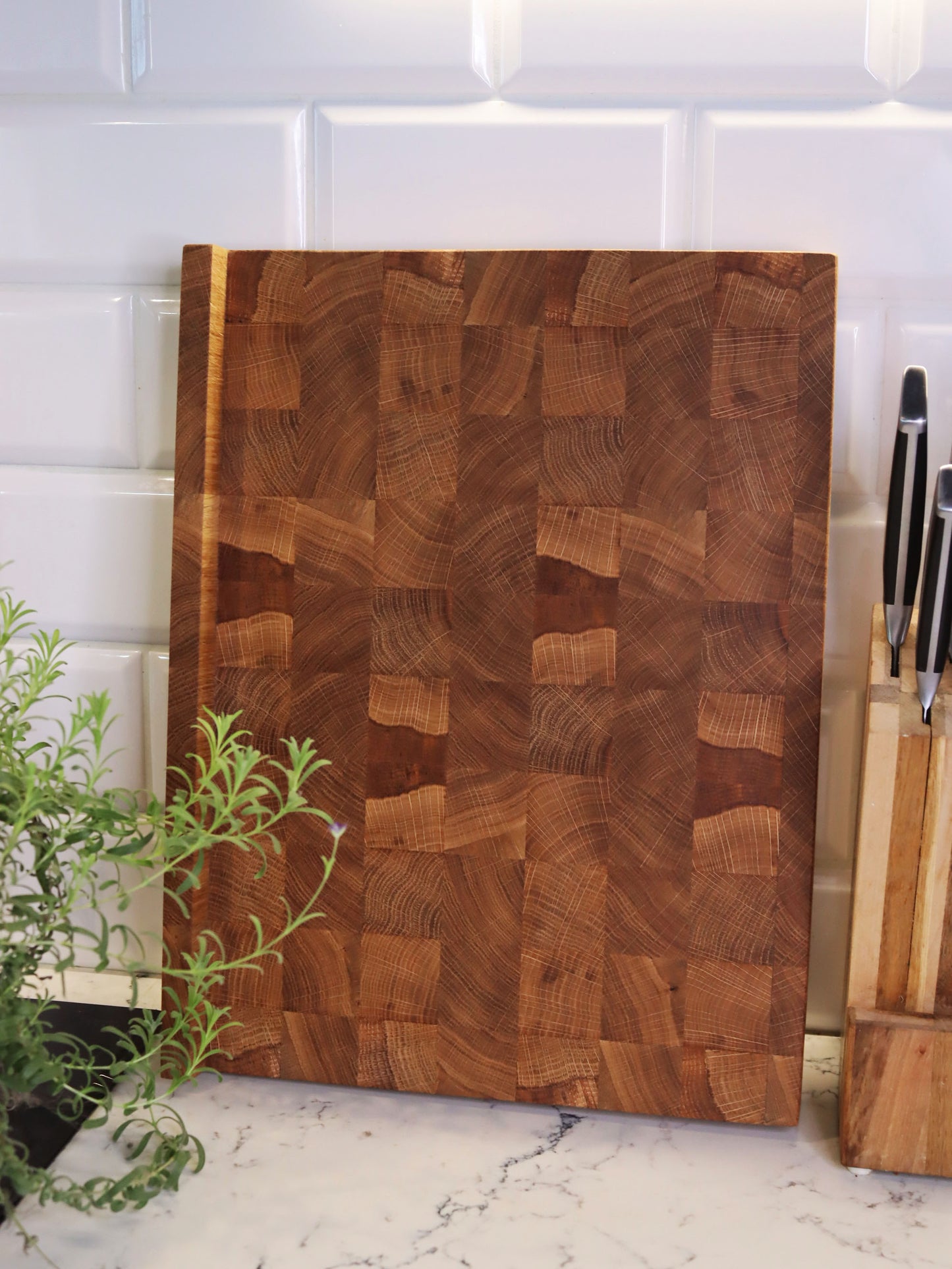 Unique end grain cutting board with double-side counter lip