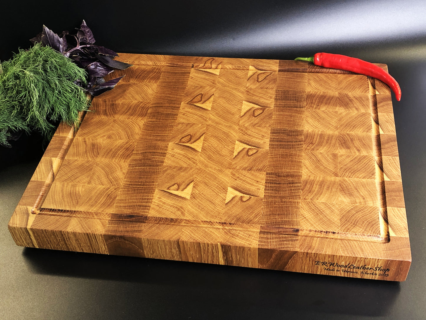 Exclusive large end grain cutting board with a juice groove