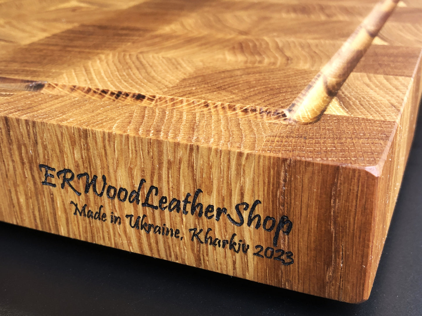 Exclusive large end grain cutting board with a juice groove