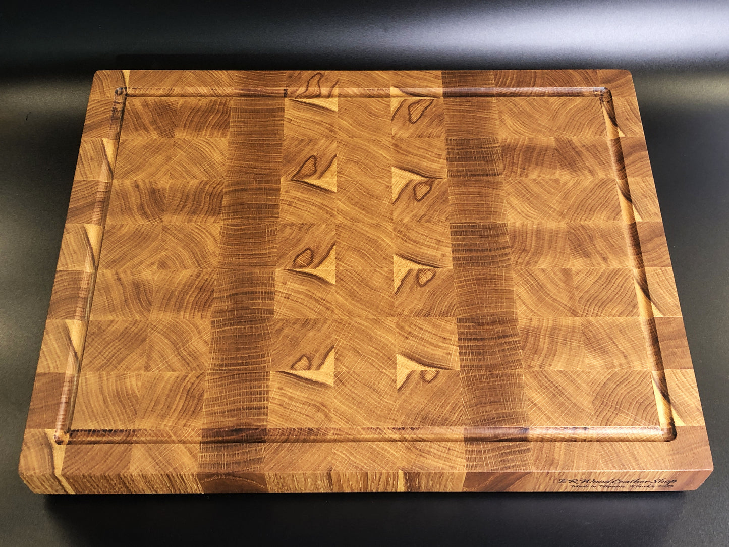 Exclusive large end grain cutting board with a juice groove