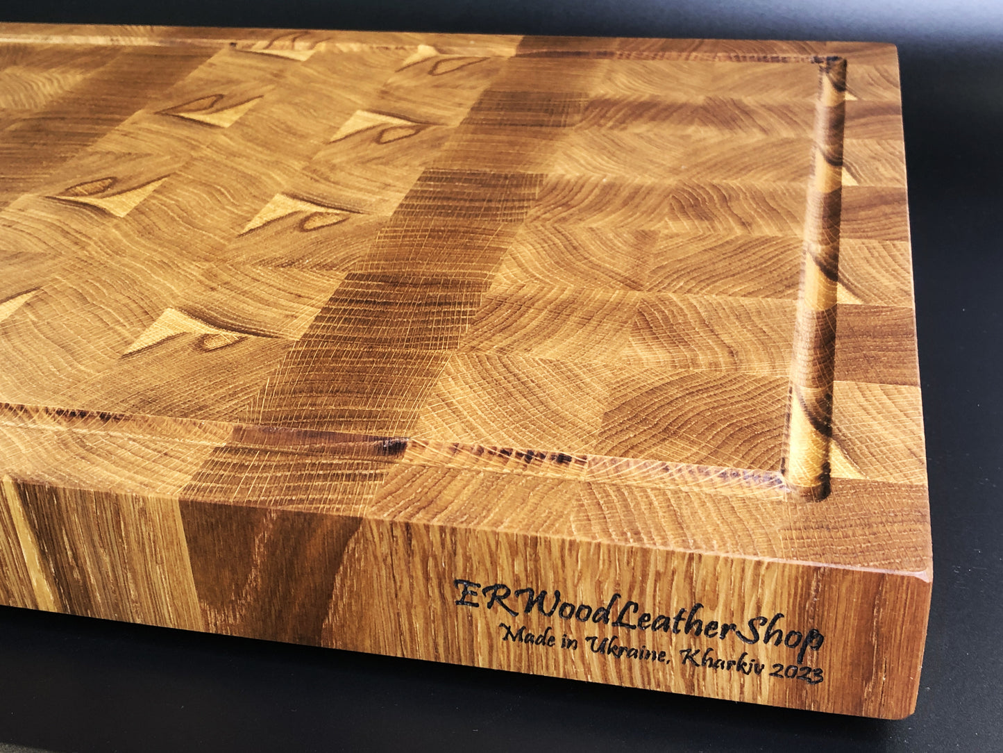 Exclusive large end grain cutting board with a juice groove