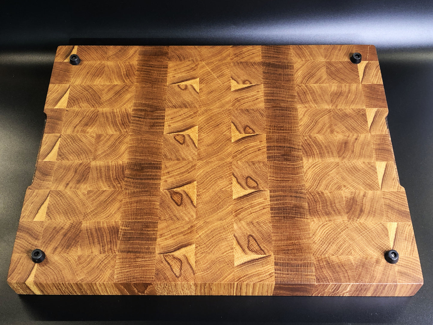 Exclusive large end grain cutting board with a juice groove