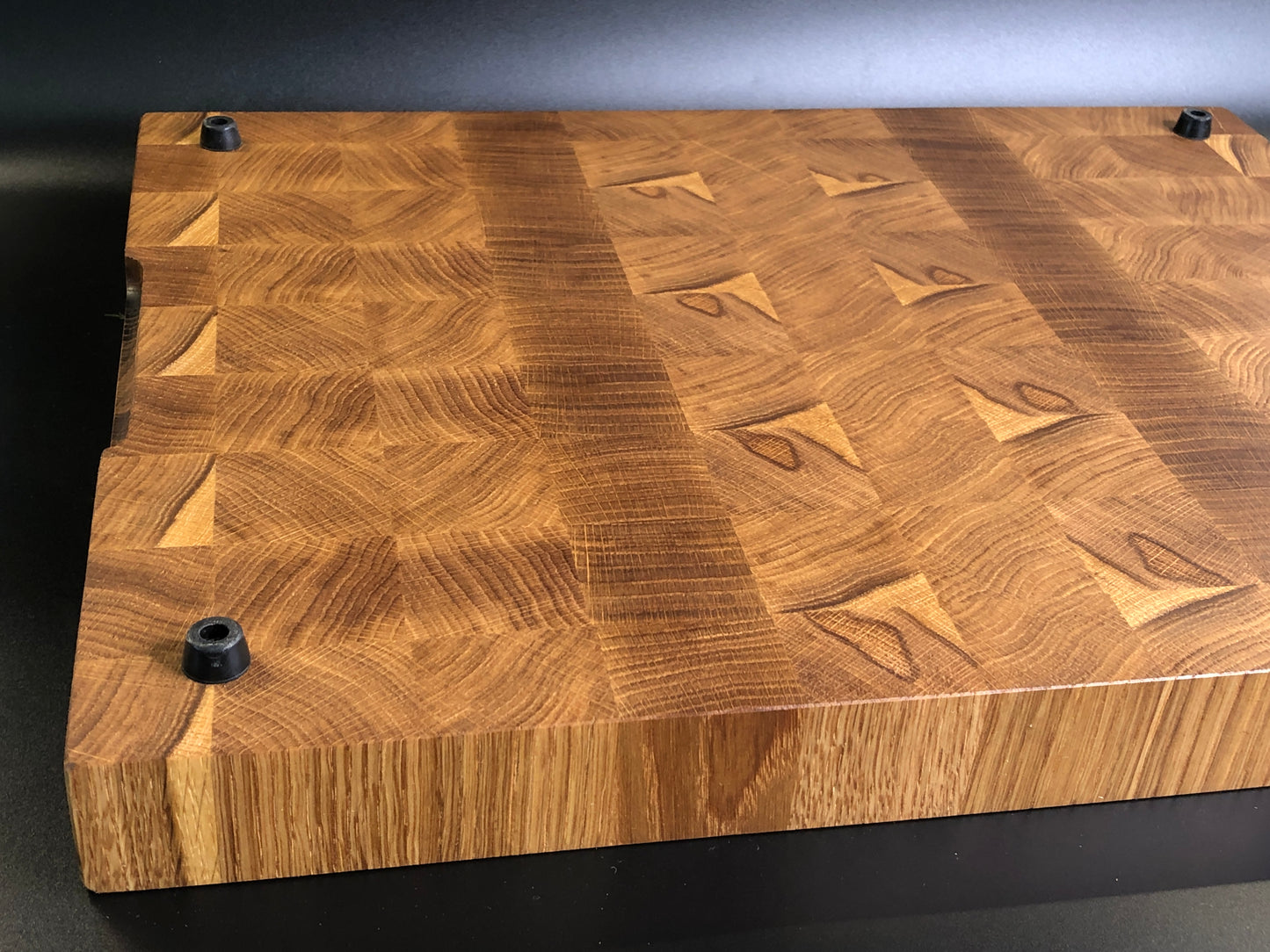 Exclusive large end grain cutting board with a juice groove