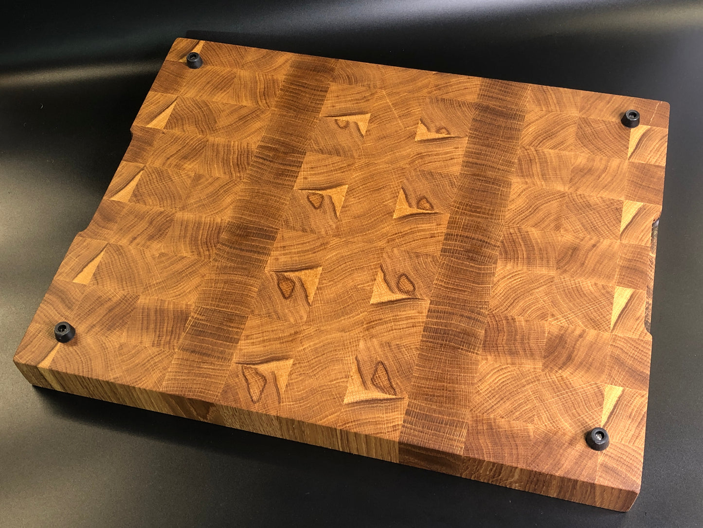 Exclusive large end grain cutting board with a juice groove